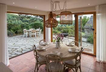 The fabulous bi-fold doors fully open to enhance your dining experience to the maximum.