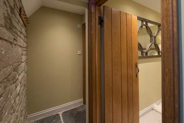 Bedroom 1 has an en suite linked via this walkway, which makes doubling this en suite as the downstairs bathroom facility easy and private.