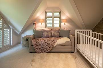 The snug has a fixed cot, and on request the sofa can also double as an alternative sleeping facility (as it converts into a super comfy double bed).
