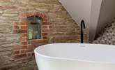 En suite to bedroom 3 boasts this beautiful free standing bath and eye-catching brickwork. - Thumbnail Image