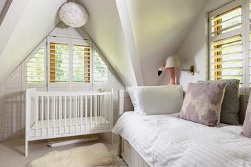 Pretty bedroom 2 also has a cot.