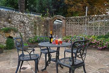 The enclosed rear patio area has a built-in barbecue and a separate drying area.