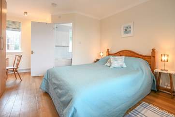 The master bedroom on the ground floor has an en suite bathroom.
