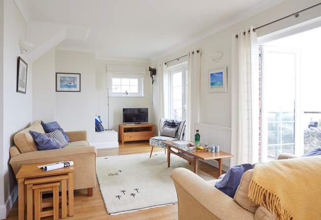 The charming open plan living space is on the first floor to make the most of the sea views.