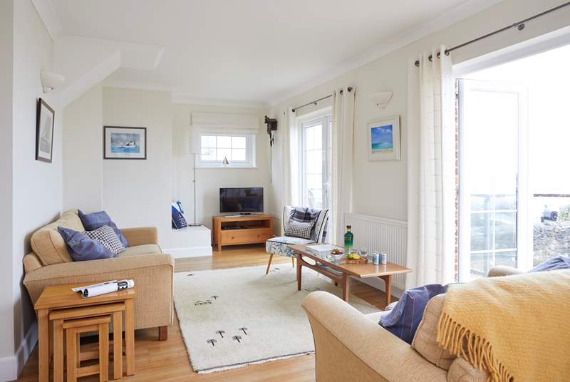 The charming open plan living space is on the first floor to make the most of the sea views.