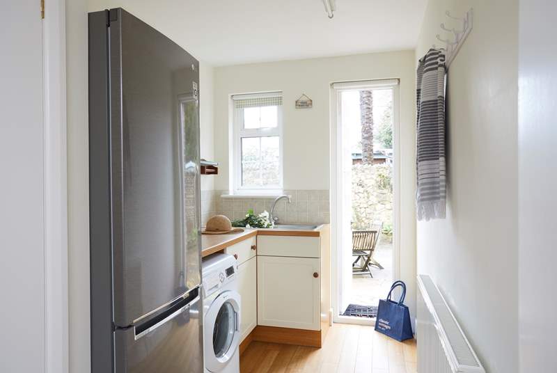 The handy utility room on the ground floor has a fridge/freezer and washing machine.