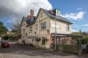 The Golden Lion at Tipton St John is a one mile walk from Cider Barn beside the River Otter.