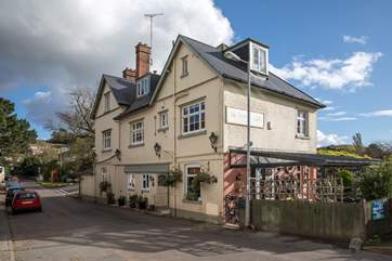 The Golden Lion at Tipton St John is a one mile walk from Cider Barn beside the River Otter.
