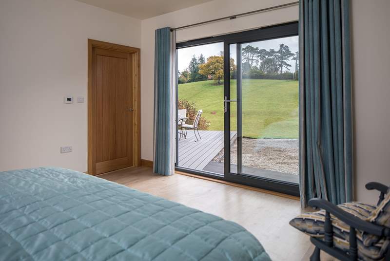 Bedroom 1 has lovely views across the valley and patio doors that open out onto the deck.