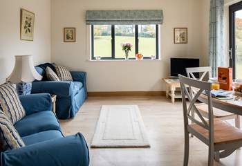 The patio doors open onto decking with beautiful views over the valley. Under-floor heating keeps you warm and snug.
