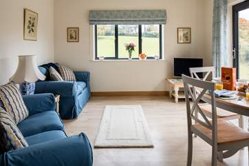 The patio doors open onto decking with beautiful views over the valley. Under-floor heating keeps you warm and snug.