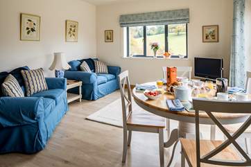 The open plan living/dining/kitchen creates a very sociable space.