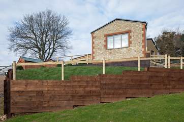 The sitting room window looks out over the valley, the enclosed garden is ideal for dogs.