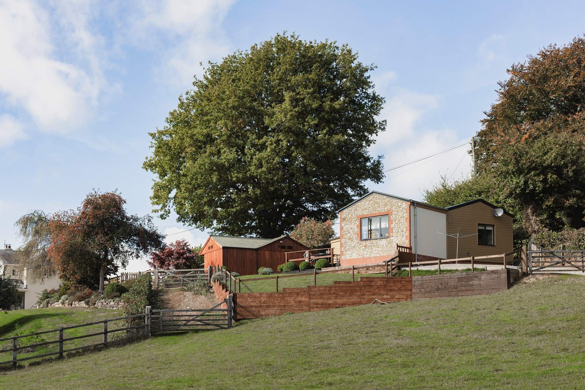 The sitting-room window looks out over the valley, the enclosed garden is ideal for small children.

