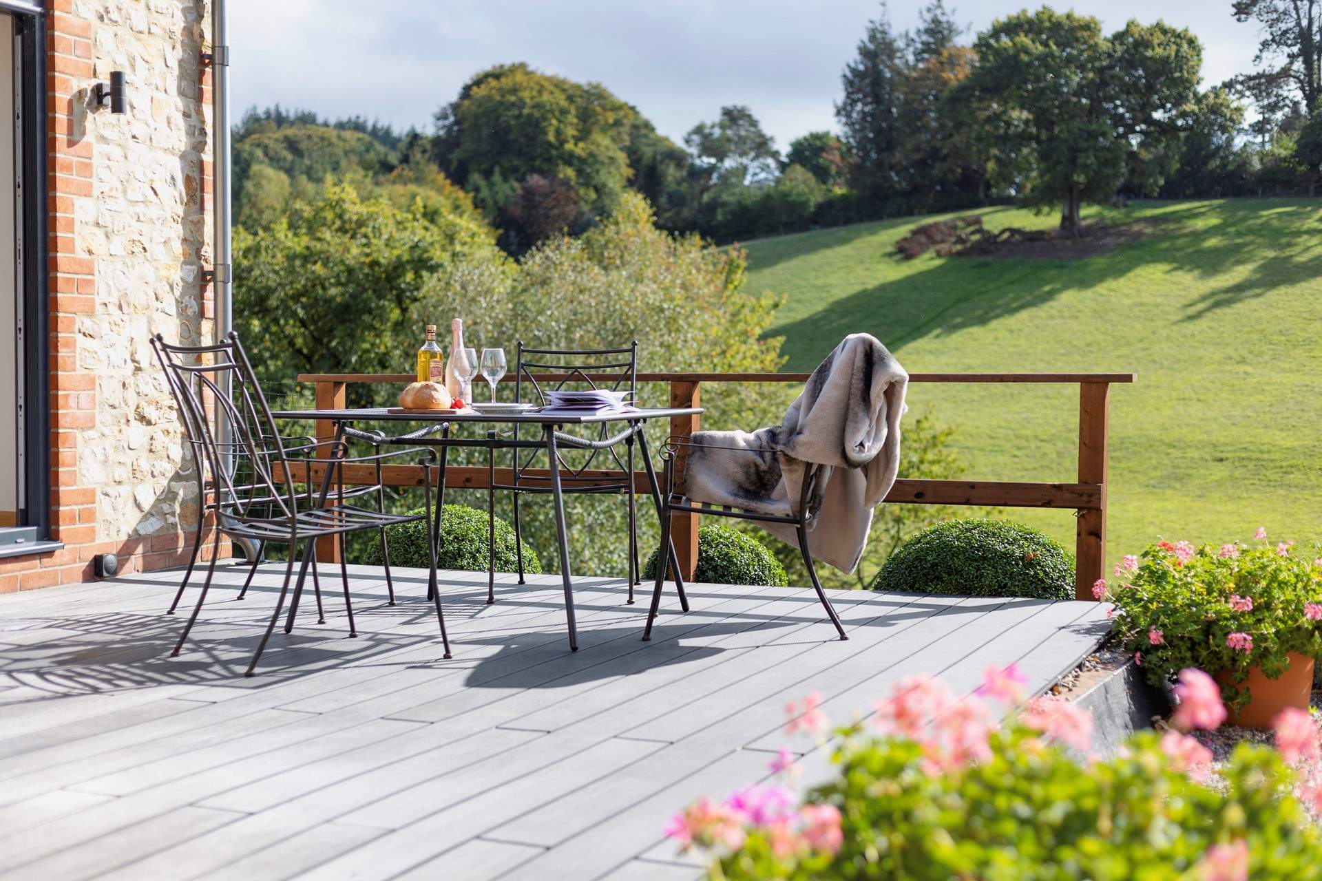 Your view onto rolling green fields part of National Landscapes (formerly known as an Area of Outstanding Natural Beauty).