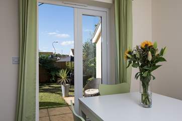 Step out of the kitchen into your own little palm tree oasis.