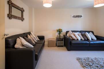 The sitting-room is comfy and homely.