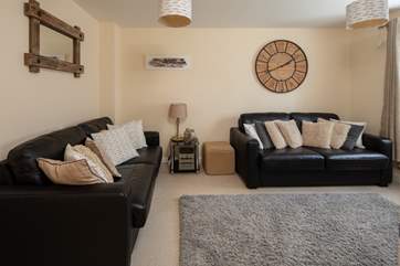 The sitting-room is comfy and homely.