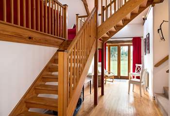 The entrance hall has a wonderful sense of space - the main staircase leads up to the sitting-room and bedroom 3, and bedrooms 1, 2 and the shower-room lead off via the stairs on the right.