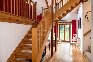 The entrance hall has a wonderful sense of space - the main staircase leads up to the sitting-room and bedroom 3, and bedrooms 1, 2 and the shower-room lead off via the stairs on the right.