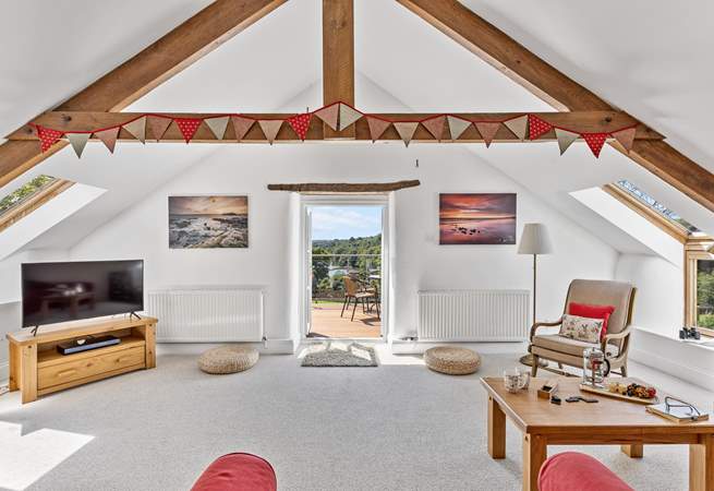 The light and airy sitting-room opens out to the balcony and that fabulous view.