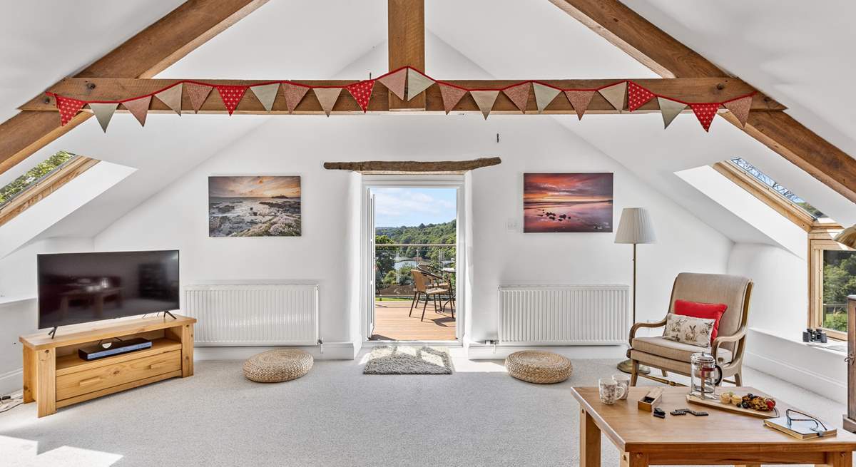 The light and airy sitting-room opens out to the balcony and that fabulous view.