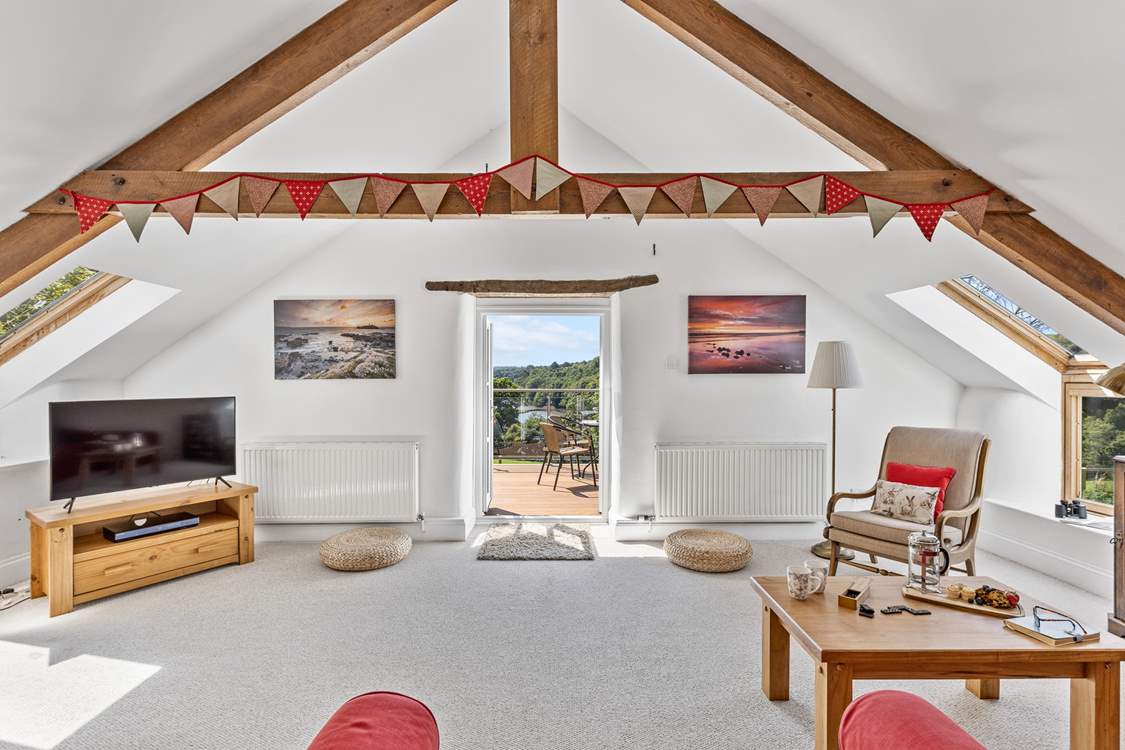 The light and airy sitting-room opens out to the balcony and that fabulous view.
