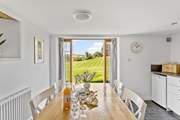 Double doors overlook the owners' garden which you are welcome to wander around.