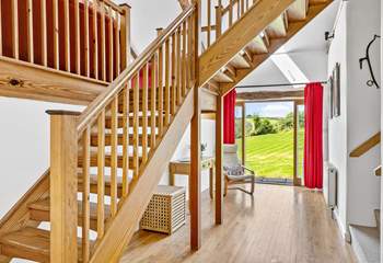 The entrance hall has a wonderful sense of space - the main staircase leads up to the sitting-room and bedroom 3. Bedrooms 1, 2 and the shower-room lead off via the stairs on the right.