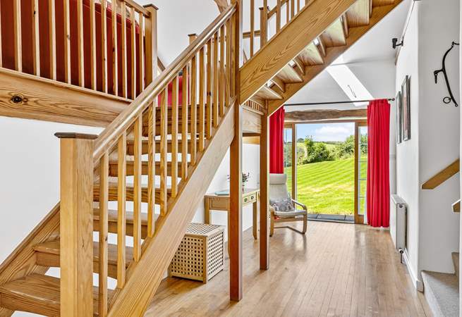 The entrance hall has a wonderful sense of space - the main staircase leads up to the sitting-room and bedroom 3. Bedrooms 1, 2 and the shower-room lead off via the stairs on the right.