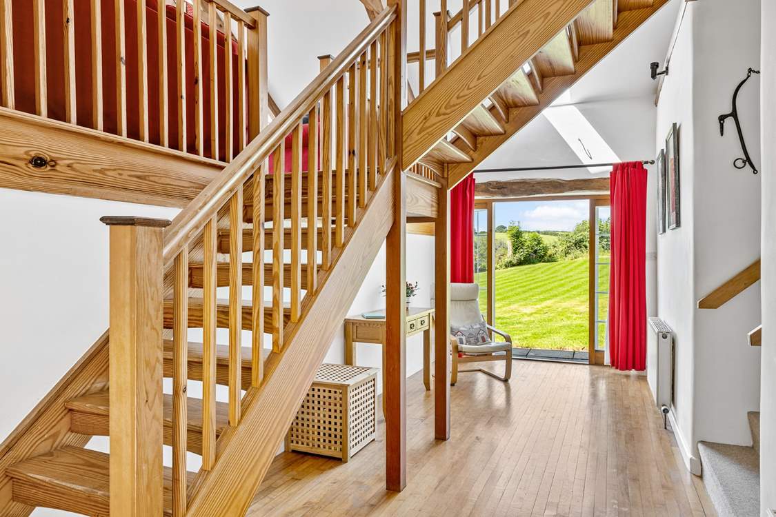 The entrance hall has a wonderful sense of space - the main staircase leads up to the sitting-room and bedroom 3. Bedrooms 1, 2 and the shower-room lead off via the stairs on the right.