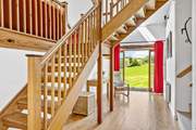 The entrance hall has a wonderful sense of space - the main staircase leads up to the sitting-room and bedroom 3. Bedrooms 1, 2 and the shower-room lead off via the stairs on the right.