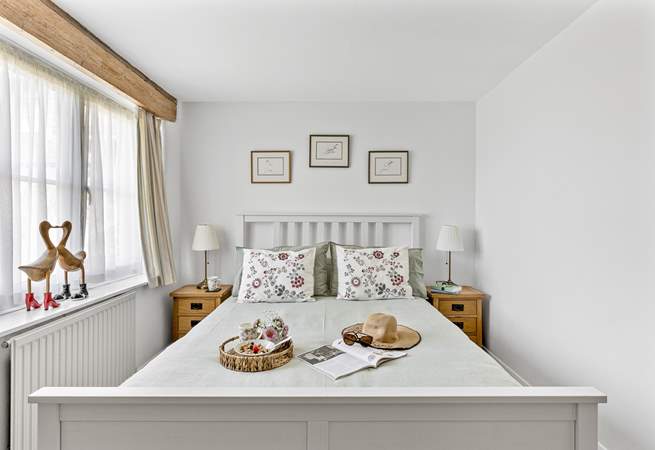 Beautiful bedroom 1 has a super comfy bed.