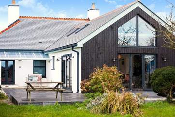 The impressive extension sits at the back making the most of the setting.
