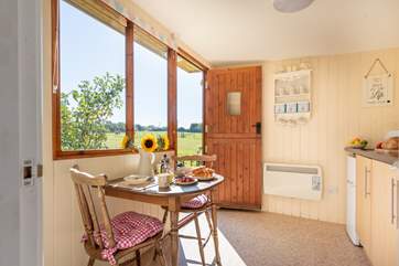 The separate cabin houses a well-equipped kitchen area, en suite shower-room and a pretty little table and chairs for eating with a view.