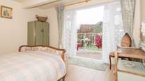 One of the double bedrooms is on the lower ground floor with doors out to the garden.