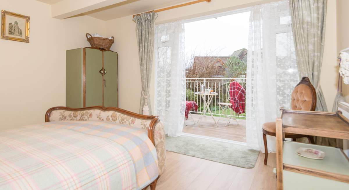 One of the double bedrooms is on the lower ground floor with doors out to the garden.