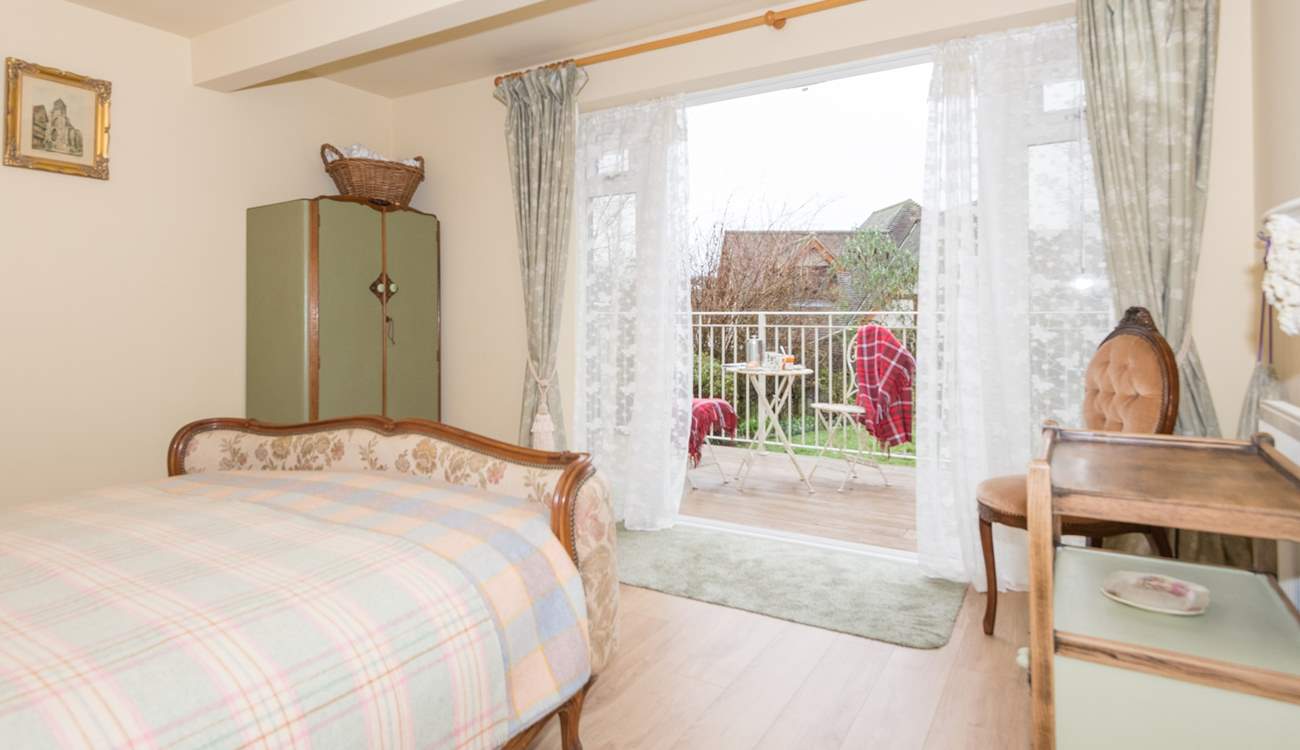 One of the double bedrooms is on the lower ground floor with doors out to the garden.