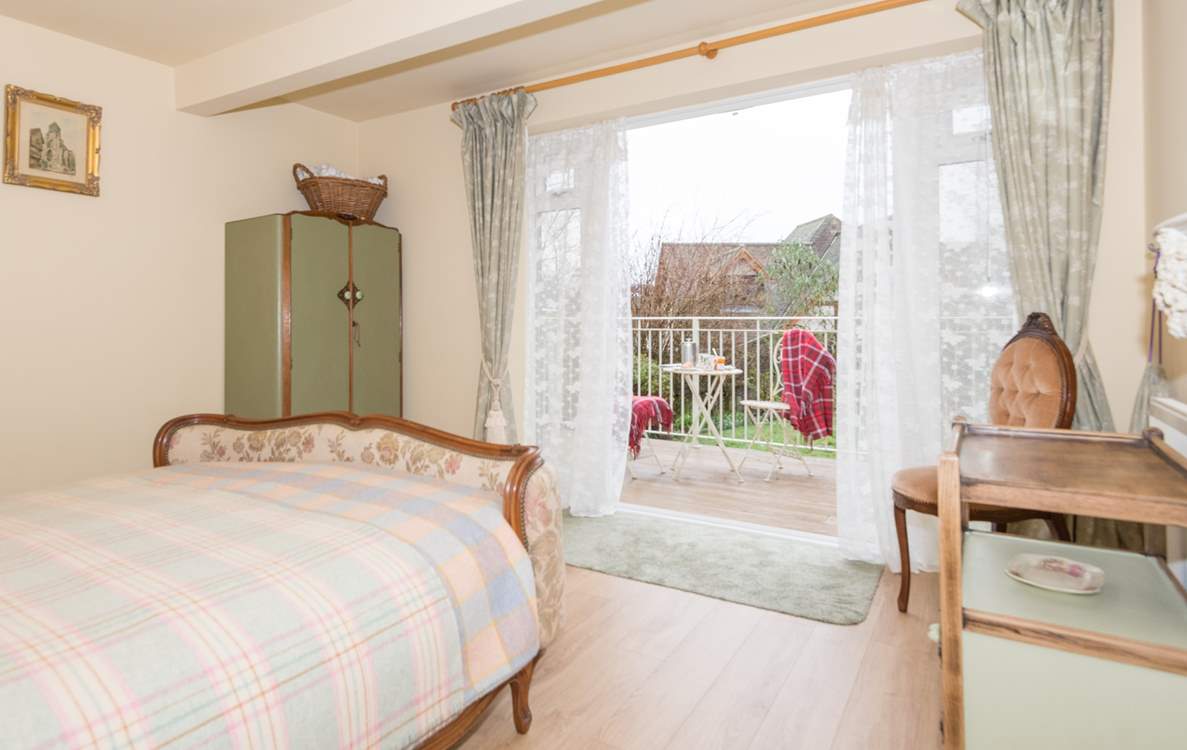 One of the double bedrooms is on the lower ground floor with doors out to the garden.
