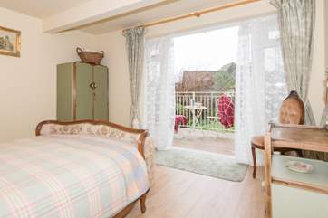 One of the double bedrooms is on the lower ground floor with doors out to the garden.