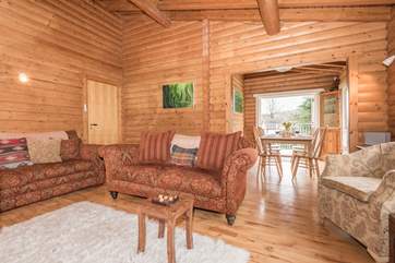 The open plan living dining room has doors leading out onto the balcony