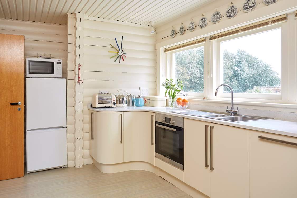 The light and airy kitchen overlooking the garden.