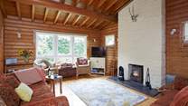The comfortable living-room with a wood-burner and plenty of space to relax.