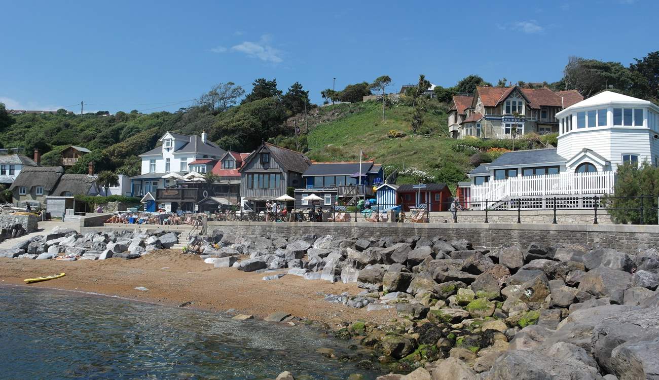 Steeple Cove with a quaint beach and selection of cafes can be reached by a steep path or the coastal walkway from Ventnor.
