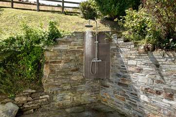 There's even an outside hot shower - perfect for washing off sandy wetsuits and bodies after a day on the beach.