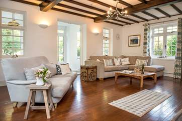 The triple-aspect sitting-room is wonderfully light and airy.