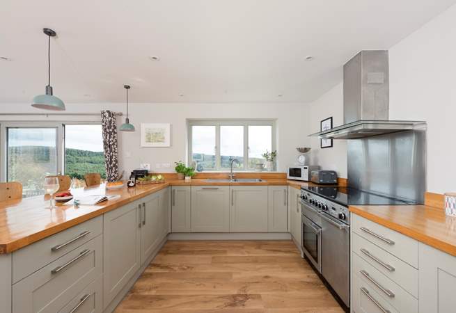 The kitchen window frames the beautiful view across the surrounding countryside.