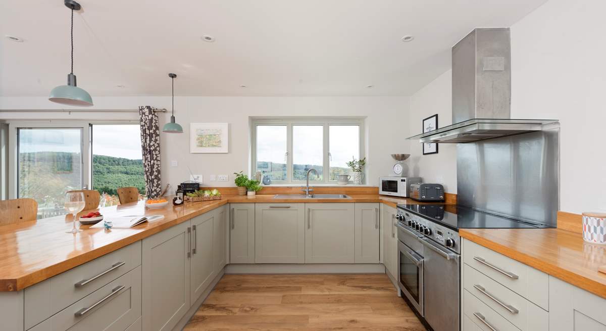 The kitchen window frames the beautiful view across the surrounding countryside.