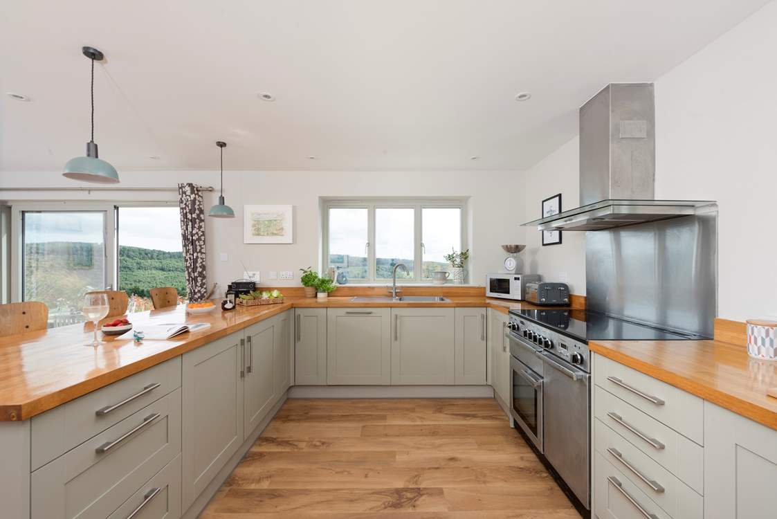 The kitchen window frames the beautiful view across the surrounding countryside.