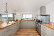 The kitchen window frames the beautiful view across the surrounding countryside.